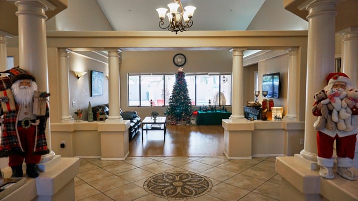 Festively decorated common area with Christmas tree