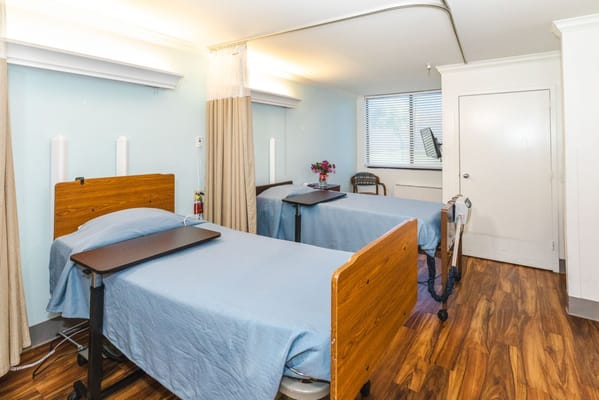 View of a shared resident room with two beds