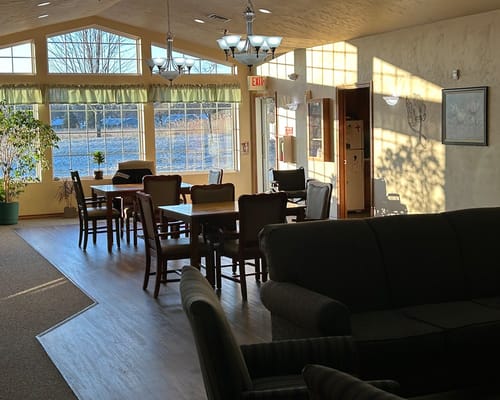 Common area with dining tables and natural light