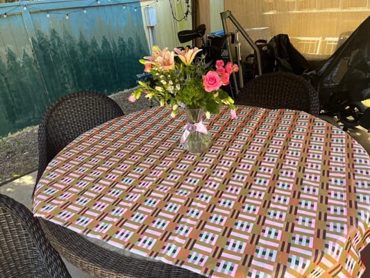 A table set with flowers in an outdoor space