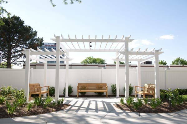 Outdoor seating area with pergolas and benches
