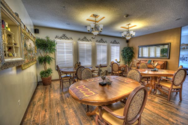 Dining area with wooden tables and chairs