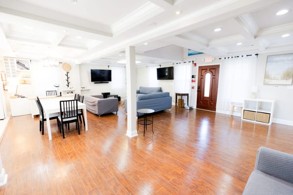 Bright common area with seating and dining options