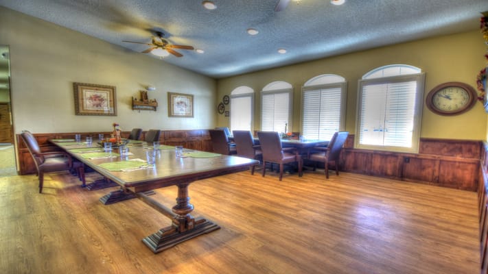 Dining area with tables and chairs set for meals