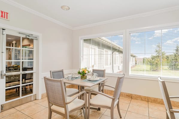 Bright common area with seating and outdoor view