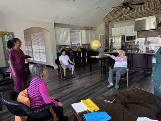 Residents and staff engaging in an indoor activity
