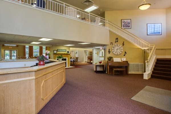 Interior view of a welcoming lobby area with stairs