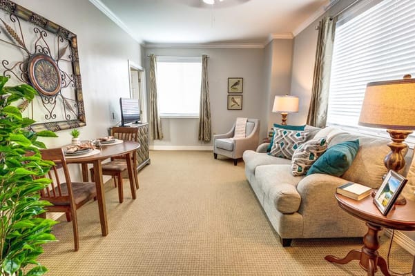Cozy interior of a resident room with living area and dining table