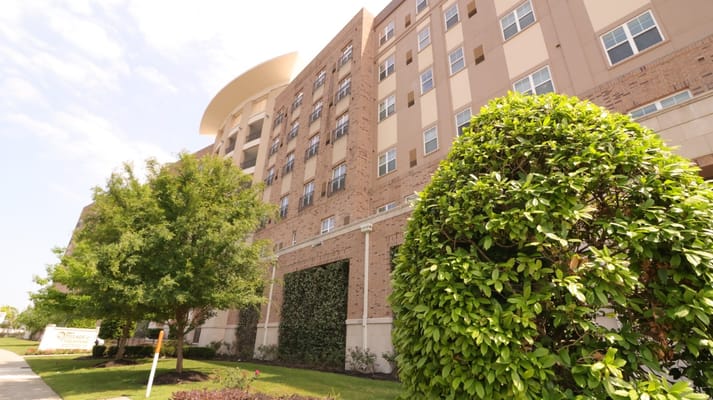 Building exterior with landscaped area in front