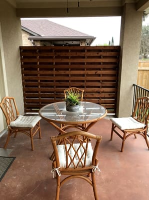 Outdoor seating area with a table and chairs