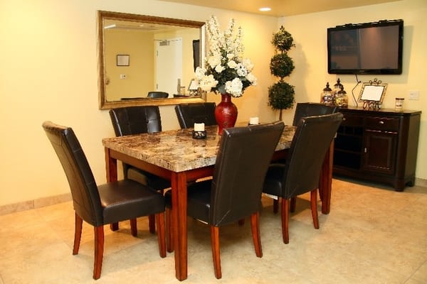 Tastefully decorated dining area with a large table and chairs