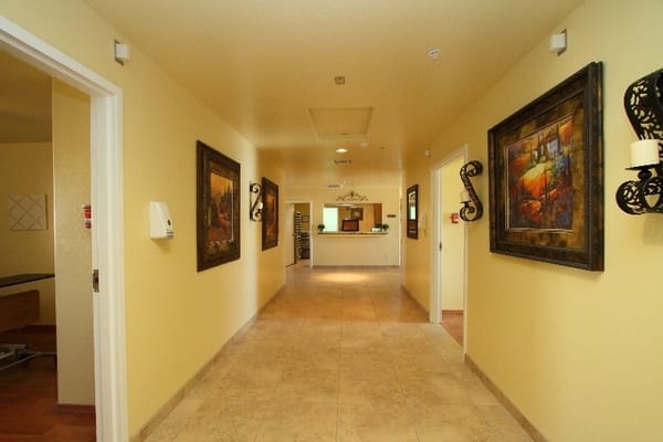 Bright interior hallway with artwork and reception area