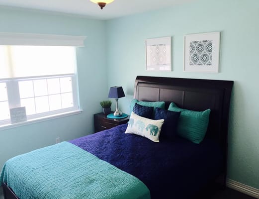 Cozy bedroom with queen bed and decorative pillows