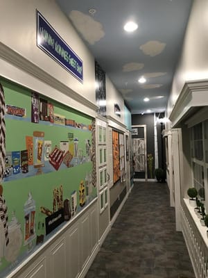 Interior hallway decorated with colorful candy-themed murals