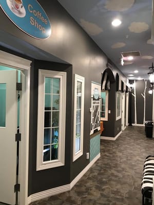 Interior hallway leading to a coffee shop.