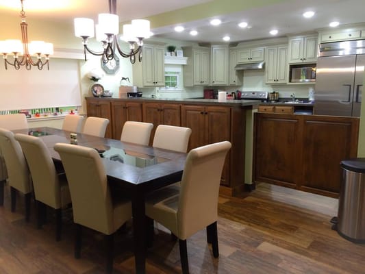 Interior view of a dining area with kitchen