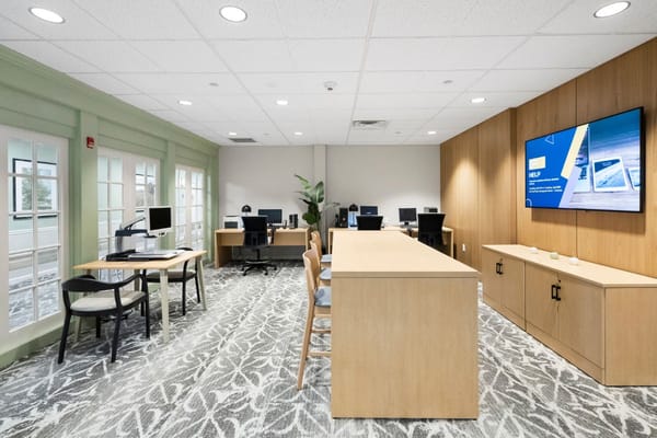Bright and modern common area with workstations