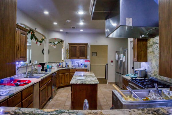 Bright kitchen area with granite countertops