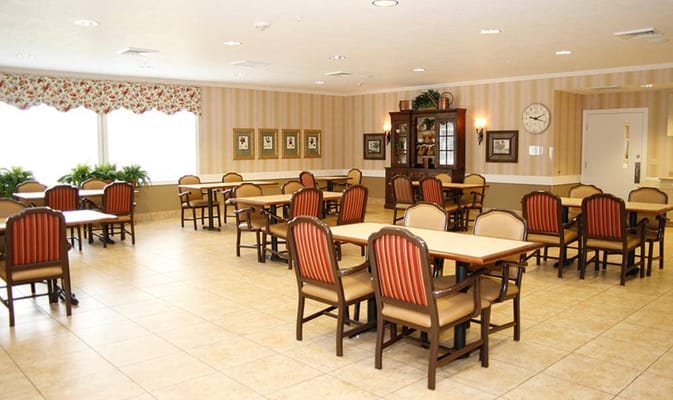 Dining area with tables and chairs arranged neatly