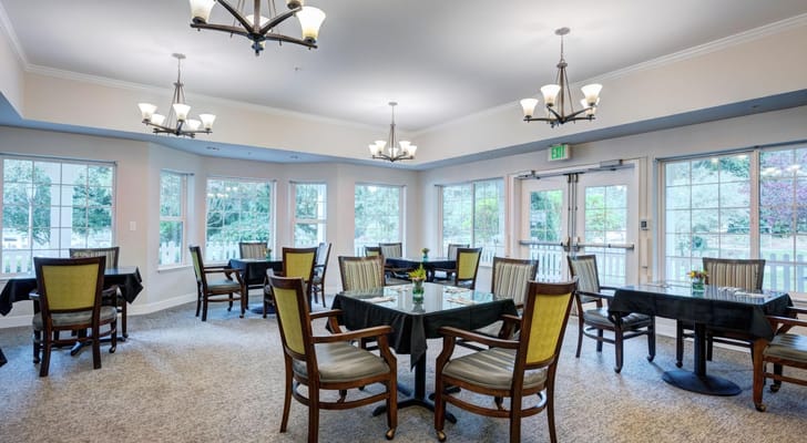 Bright dining area with tables and chairs