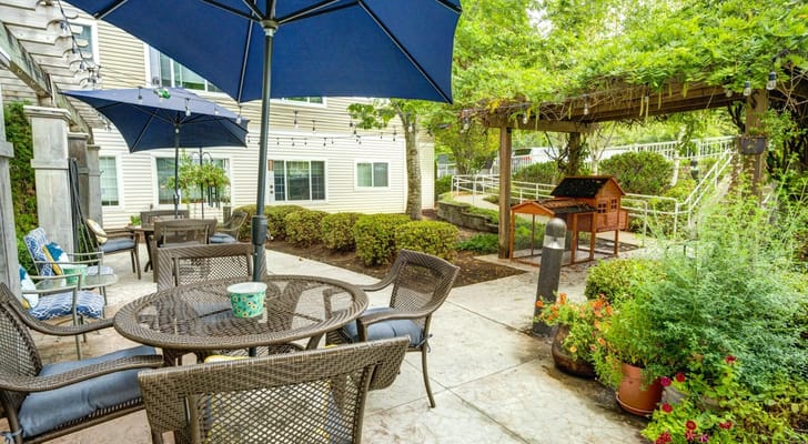 Outdoor seating area with umbrellas and plants