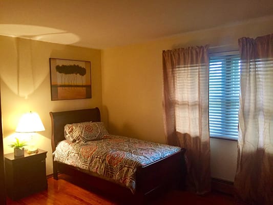 Cozy bedroom with a bed and soft lighting