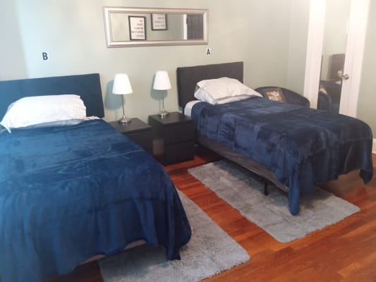 A shared resident room with two beds and nightstands