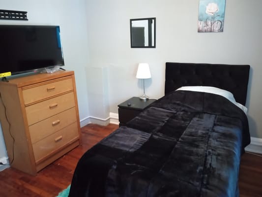 Neatly arranged private bedroom in a facility