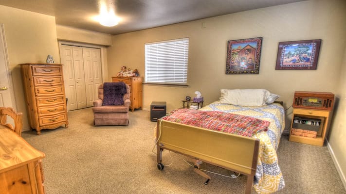 Cozy resident room with a bed and furniture