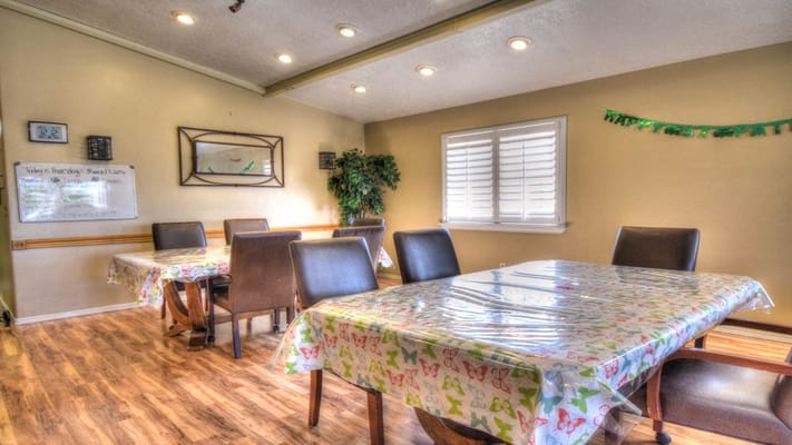 Dining area with tables and colorful tablecloths