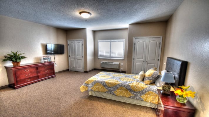 Cozy resident room with a bed and dresser