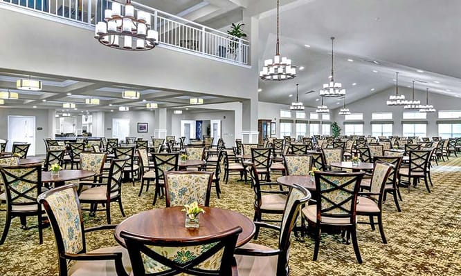 Spacious dining room with tables and chairs at Belmont Gardens