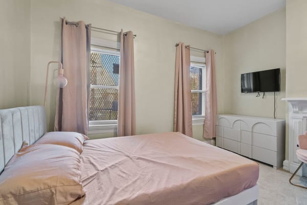 Cozy private room with a bed and dresser