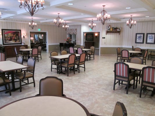 Bright dining area with tables and chairs