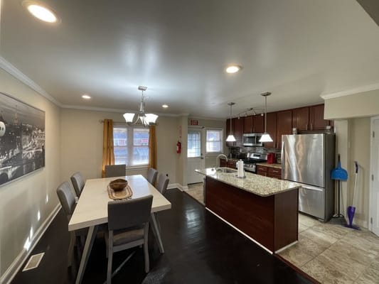Spacious kitchen and dining area with modern appliances and a dining table