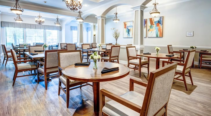 Bright dining room with wooden tables and chairs