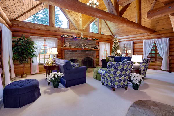 Cozy common area with rustic log design and holiday decor