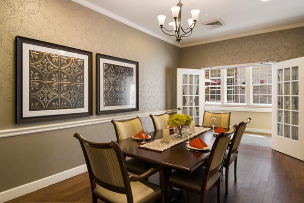 Elegant dining room with a table set for a meal