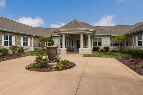 Welcoming entrance area of Churchill Place with landscaped gardens
