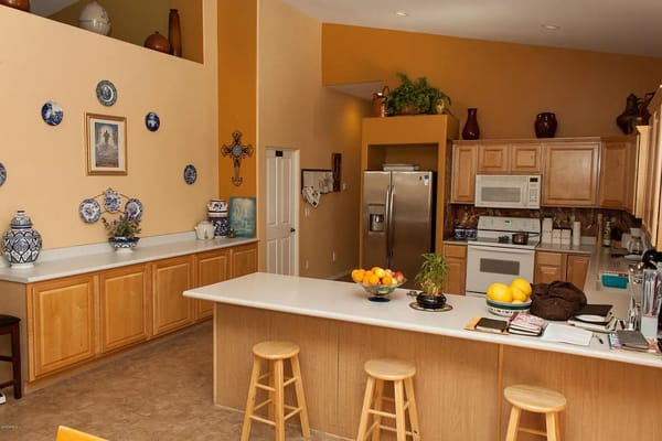 Bright kitchen with wooden cabinets and a large island