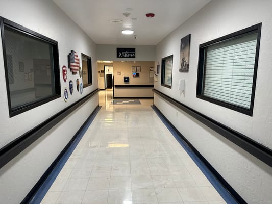 Bright hallway with welcoming decor and signage