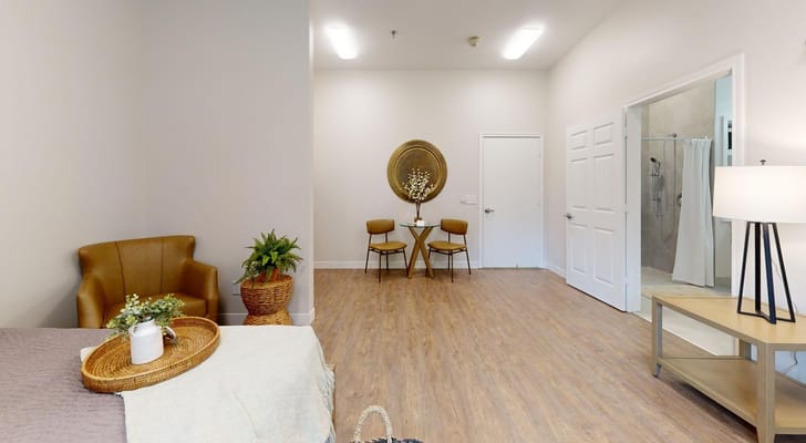 Cozy interior of a private resident room with seating