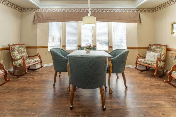 Common area with comfortable chairs and a table