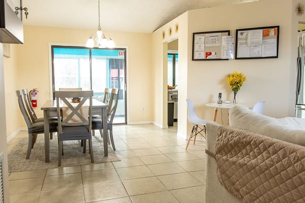 Bright dining area with a table and chairs at Endless Care Assisted Living