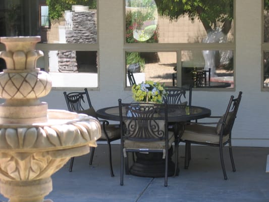 Outdoor seating area with a table and flowers