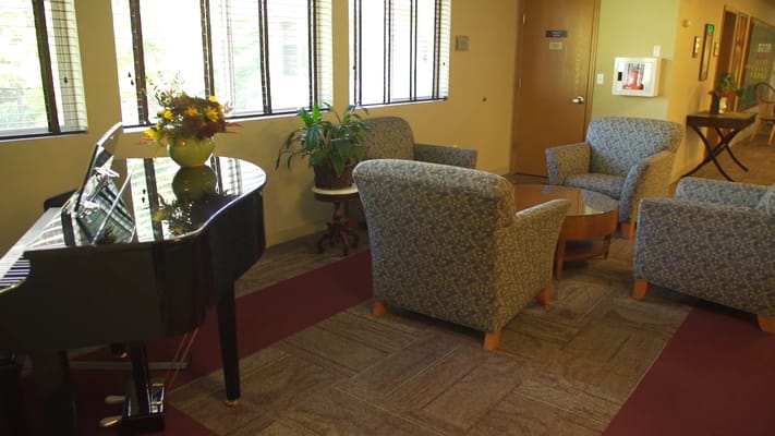 Interior common area with seating and piano
