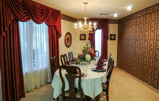 A beautifully set dining table in a well-decorated room