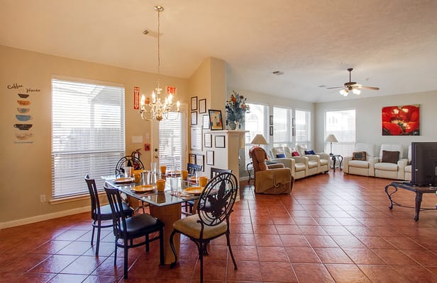 Bright and spacious living room and dining area with seating and decor