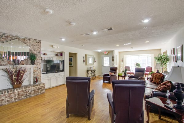 Cozy living room with chairs and a television