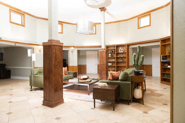 Cozy common area with green seating and decor